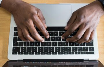 Hands on laptop keyboard